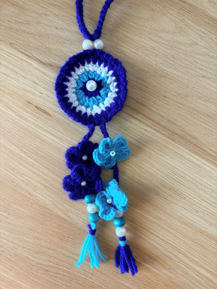 Evil-Eye Bhabhi Lumba — handmade crochet rakhi by TASSELA