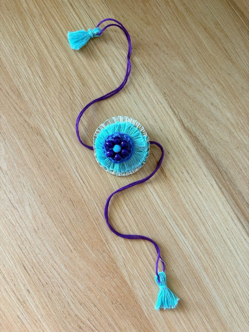 Evil-Eye Nazariya Rakhi — handmade crochet rakhi by TASSELA