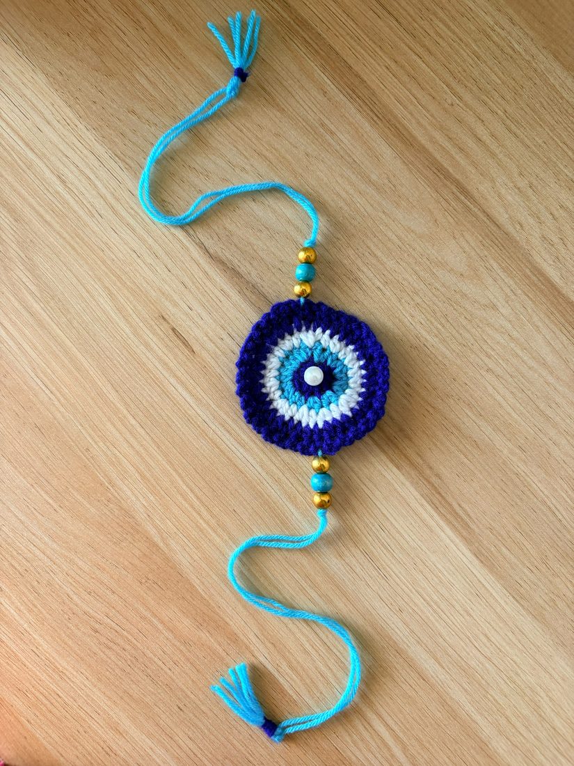 Evil-Eye Rakhi — handmade crochet rakhi by TASSELA