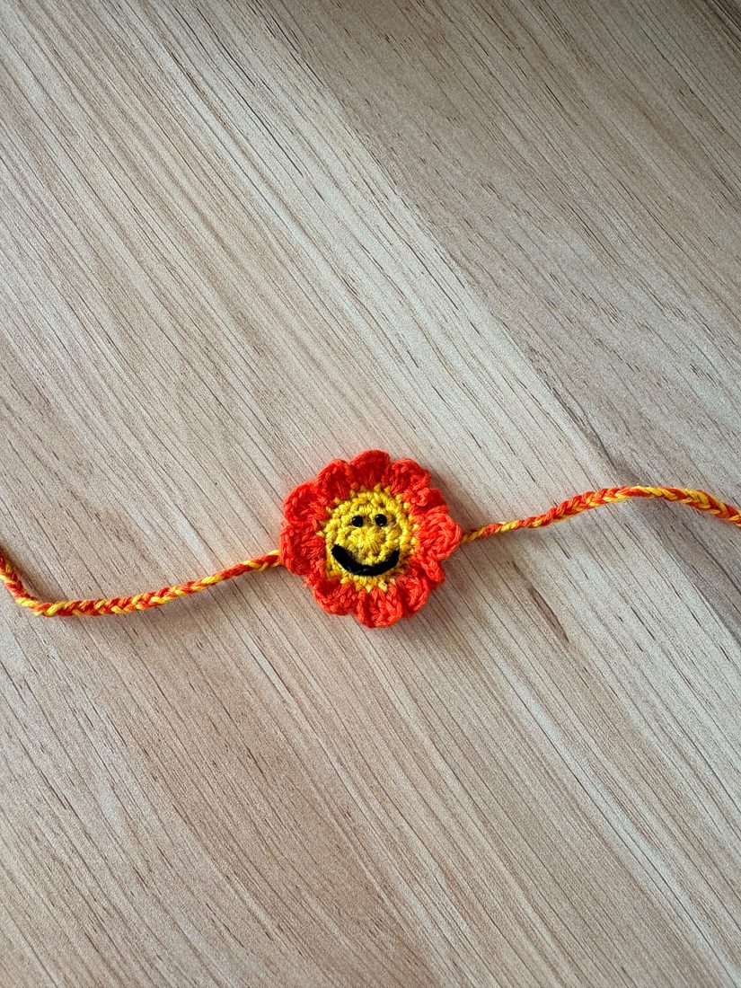 Smiley Flower Rakhi — handmade crochet rakhi by TASSELA